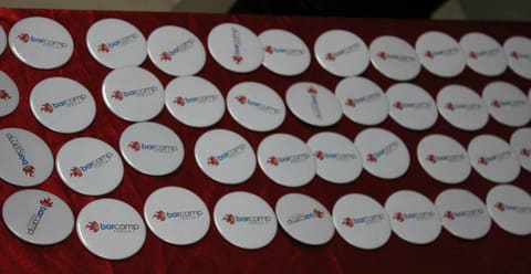 Rows of stickers on a red cloth